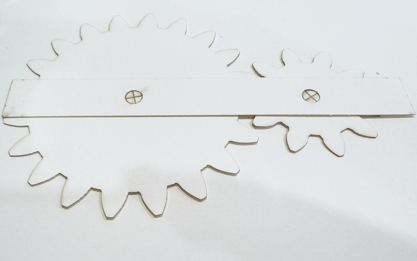 Two paper gears with a too-short paper brushing